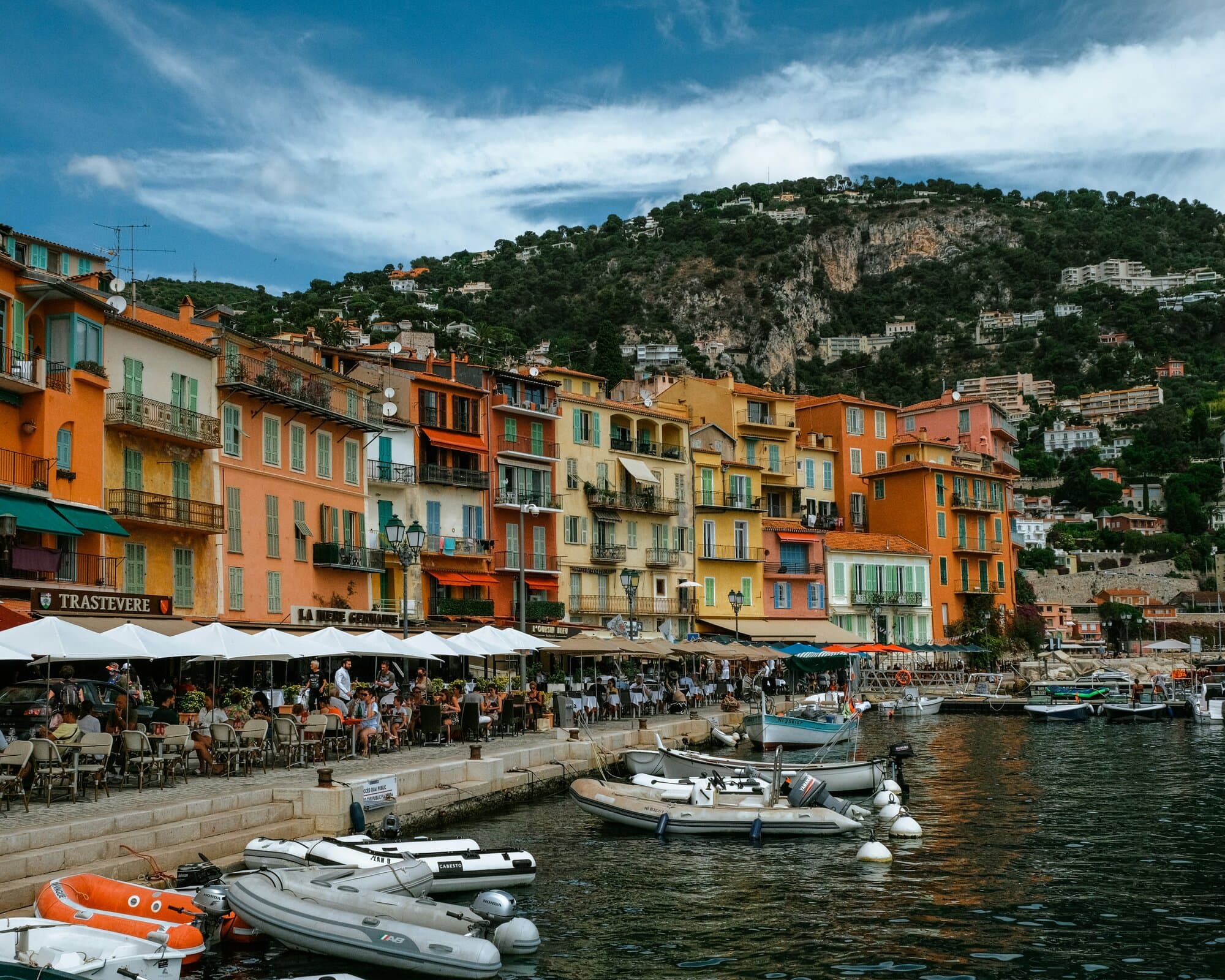 Villefranche-sur-Mer harbor with the colored facades along Quai de l'Amiral Courbet.